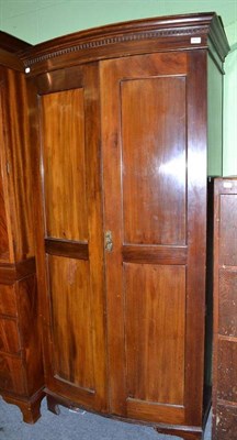 Lot 571 - Edwardian mahogany bowfront wardrobe