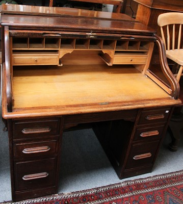 Lot 1237 - An Oak Roll Top Desk, circa 1930, 122cm by...