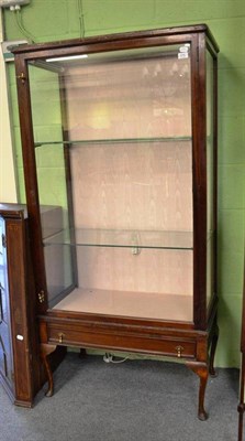 Lot 576 - A freestanding mahogany display cabinet with brass furniture and cabriole legs