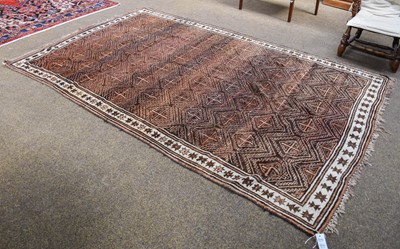 Lot 1011 - A Baluch Carpet, the charcoal field with...