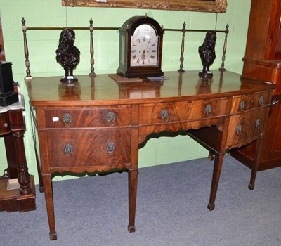 Lot 587 - A Regency mahogany bow fronted sideboard with cellaret drawer