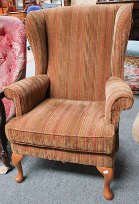 Lot 1192 - A Modern Wing Back Chair, with striped upholstery