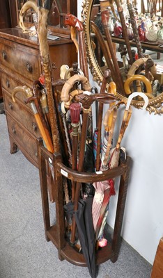 Lot 1200 - A Collection of Walking Sticks and Parasols,...