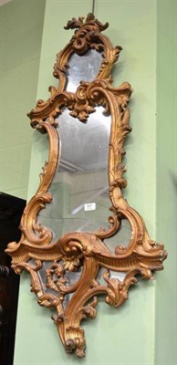 Lot 597 - A 19th century Rococo pier glass with a carved and gilt gesso frame