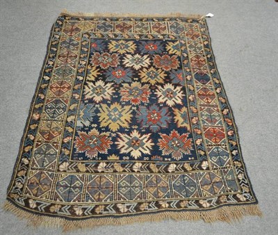 Lot 599 - Kuba Rug, North East Caucasus, the deep indigo field with columns of stylised flowerheads...