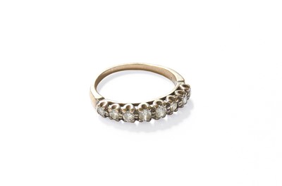 Lot 169 - A Diamond Half Hoop Ring, eight round...