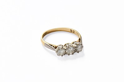 Lot 170 - A Diamond Three Stone Ring, the round...