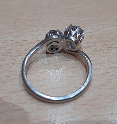 Lot 2331 - A Diamond Two Stone Twist Ring the round...