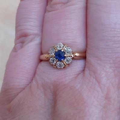 Lot 2060 - An 18 Carat Gold Sapphire and Diamond Cluster...