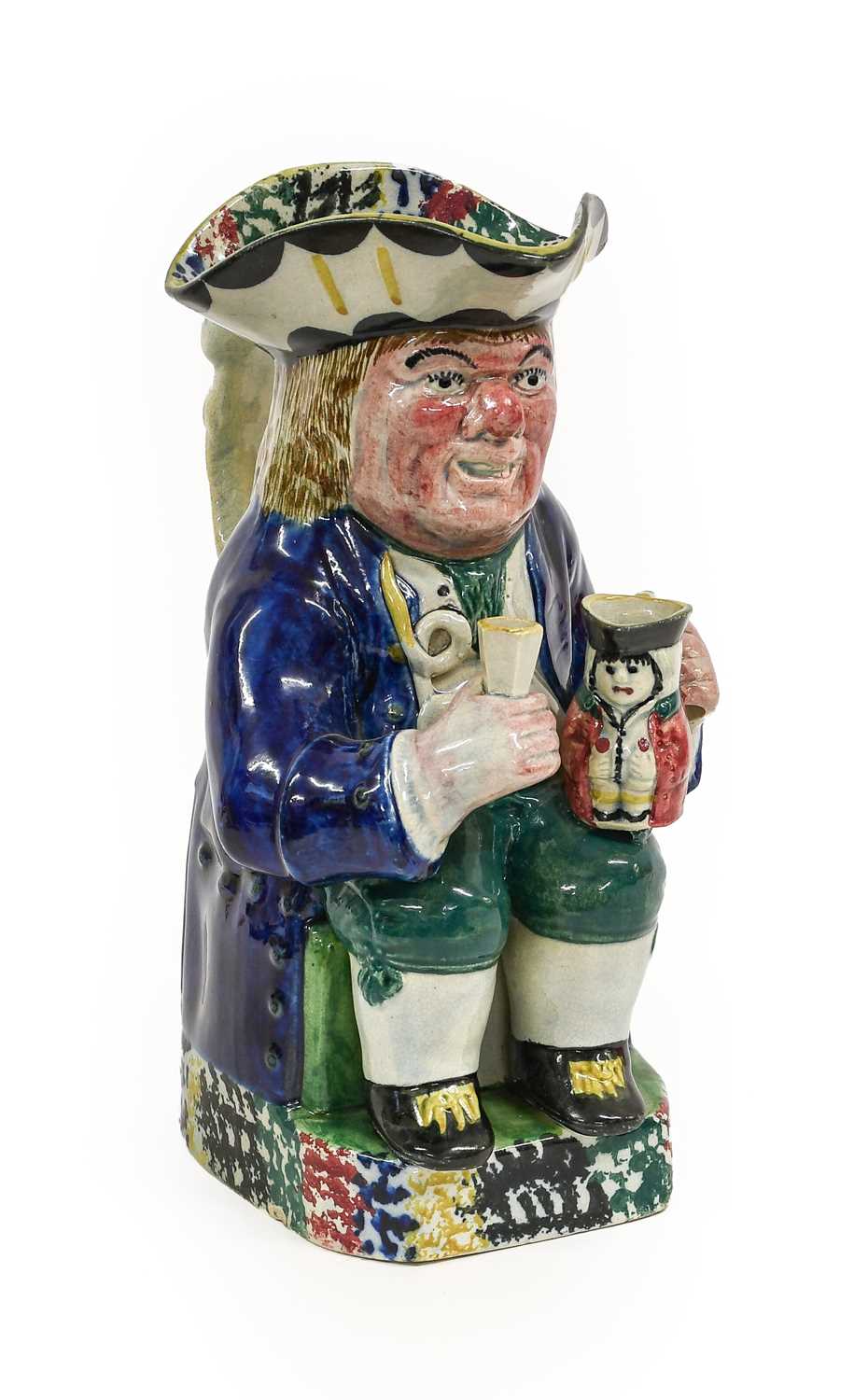 Lot 54 - A Yorkshire Prattware Toby Jug, circa 1810, of...