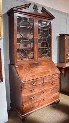 Lot 1121 - A George III Mahogany Bureau Bookcase, with...