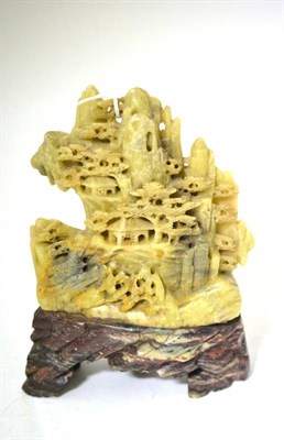 Lot 211 - A Chinese Green Soapstone Mountain Group, Qing, carved with pagodas and trees amongst...