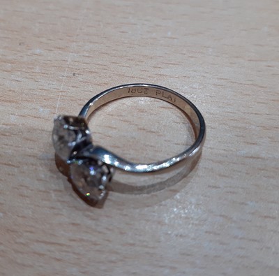 Lot 2329 - A Diamond Two Stone Twist Ring the round...