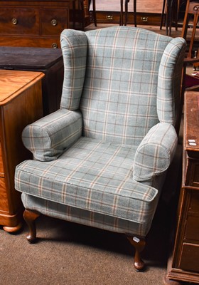 Lot 1300 - A Wing Chair, with oak frame and checked...