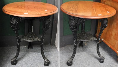 Lot 1197 - A Pair of 20th-Century Cast Iron Pub Tables,...