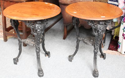 Lot 1202 - A Pair of 20th-Century Cast Iron Pub Tables,...