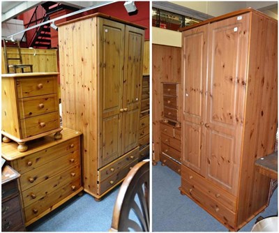 Lot 664 - A pair of pine double wardrobes, two four height chests of drawers and two bedside chests