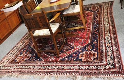 Lot 1004 - Kashgai Carpet, the raspberry lozenge field...