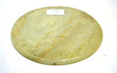 Lot 219 - A Chinese Jade Type Plaque, of cushion circular form with scroll panel border, 18.5cm diameter