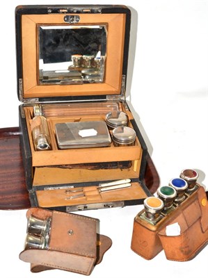 Lot 4 - A leather travelling dressing case with glass plated fittings, a cased set of toilet bottles...