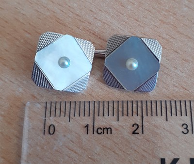 Lot 2095 - A Mother-of-Pearl and Split Pearl Button,...