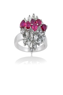 Lot 2159 - A Ruby and Diamond Cluster Ring an undulating...