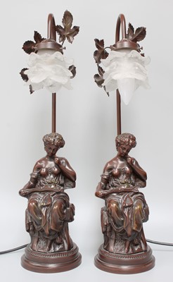 Lot 1252 - A Pair of Bronzed Composite Figural Tablelamps,...