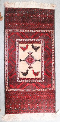 Lot 1014 - A Baluch Rug, the camel field with diamond...