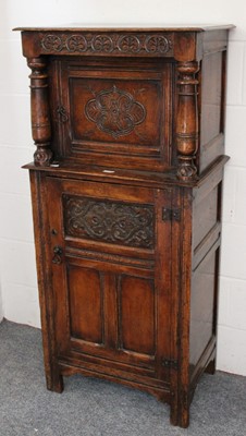 Lot 1275 - An Early 20th Century Carved Oak Cupboard, in...