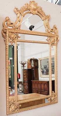 Lot 1183 - A Modern Gilt Framed Overmantel Mirror, floral...