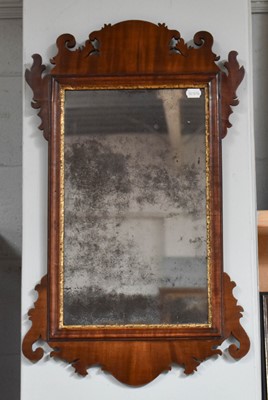 Lot 1247 - A Georgian Fret Cut Mirror, with original...