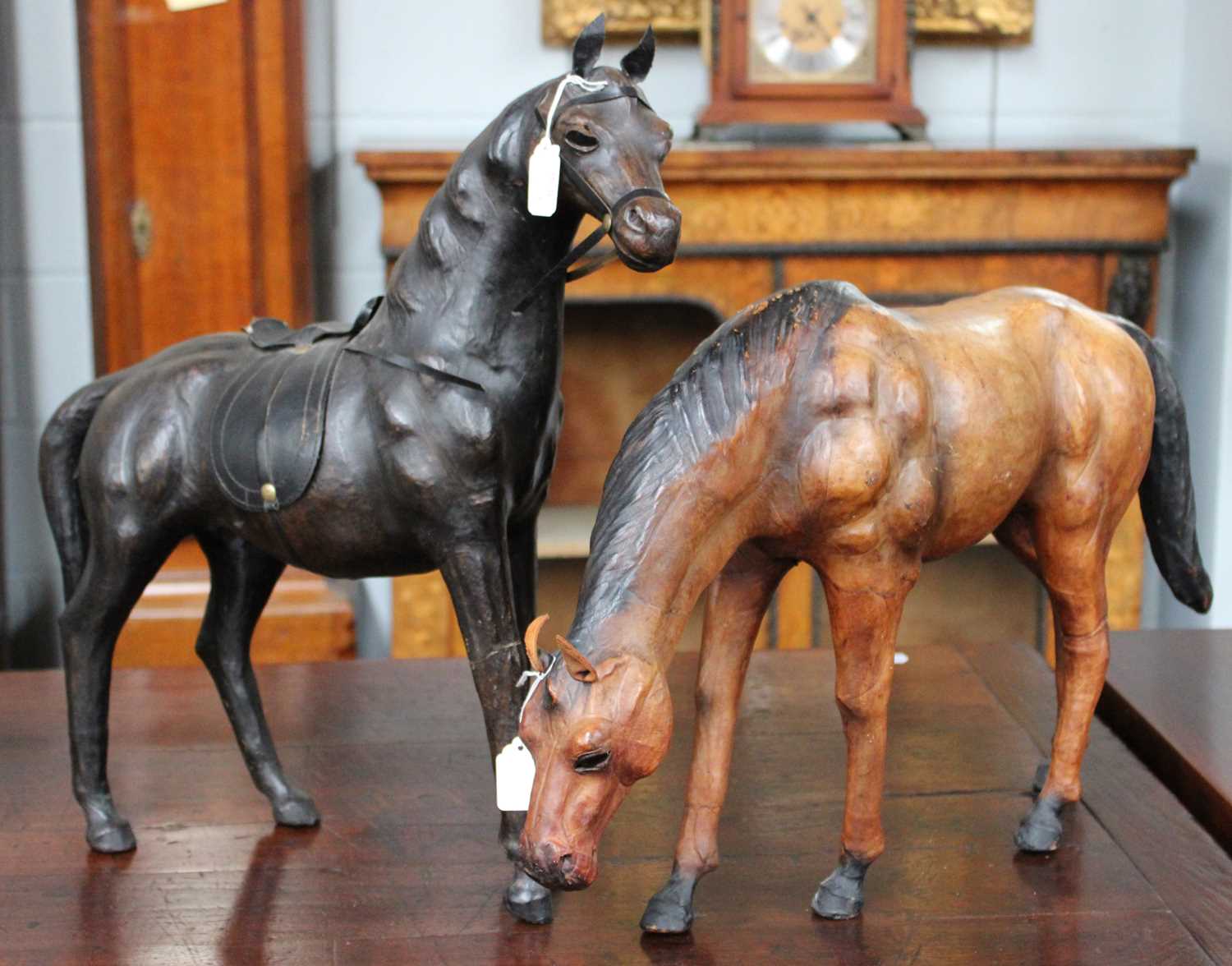 Lot 354 - Two Liberty Style Leather Horse Models, the...