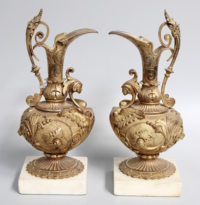 Lot 207 - A Pair of Gilt Bronze Ewers, raised on square...