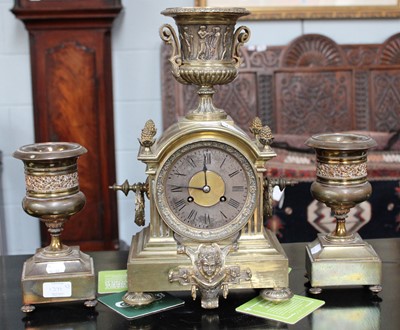 Lot 414 - A French Brass Striking Clock Garniture, circa...