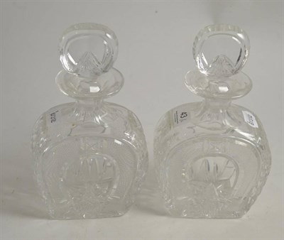 Lot 43 - A pair of horseshoe shaped decanters