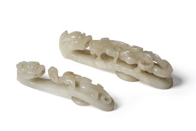 Lot 224 - A Chinese White Jade Belt Hook, Qing Dynasty, carved with a chilong and with dragon head...