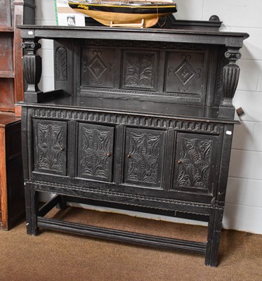 Lot 1363 - An Ebonised and Carved Oak Court Cupboard,...