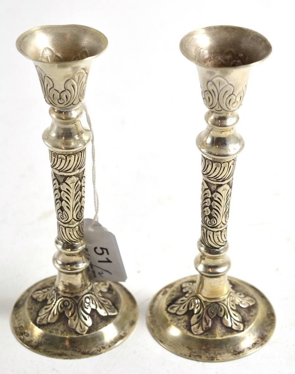 Lot 51 - A pair of Russian pricket candlesticks, on tapering feet, bearing Russian silver marks
