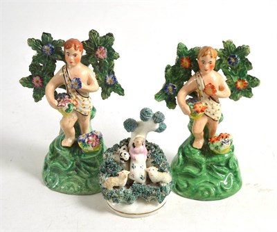 Lot 52 - Pair of Walton pottery figures and a small Staffordshire figure of a shepherdess and sheep