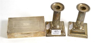 Lot 67 - A pair of Walker & Hall dwarf candlesticks, Sheffield 1895; and a silver cigarette box,...