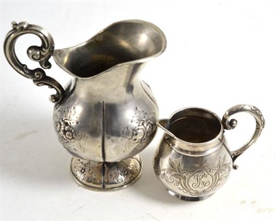 Lot 70 - Two Russian jugs, one with sparrow beak lip, both bear Russian silver marks