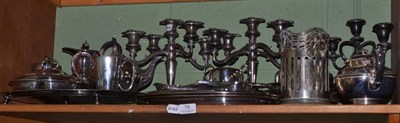 Lot 76 - A shelf of assorted silver plate including large tray, candelabra etc