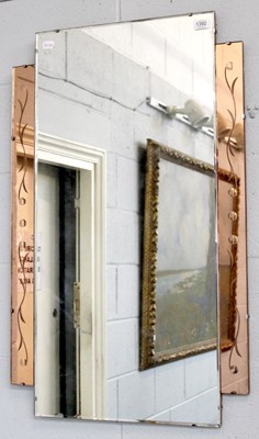 Lot 1392 - An Art Deco Frameless Mirror, with copper...