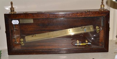 Lot 91 - Negretti and Zambra steam gauge glass tube on brass calibrated back mounted in stained wood...