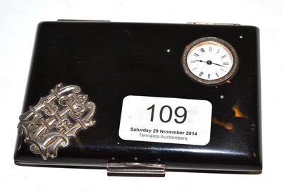 Lot 109 - An unusual tortoiseshell cigarette case set with watch and aide memoir