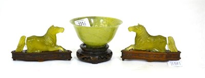Lot 231 - A Pair of Green Jade Type Figures of Horses, recumbent with flowing tails and manes, 11cm long; and