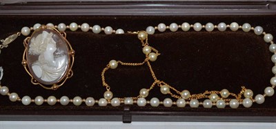 Lot 114 - A cameo brooch stamped ";9c";, a cultured pearl necklace and a simulated pearl necklace