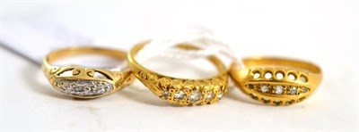 Lot 122 - Two 18ct gold five stone diamond rings and a similar 9ct gold ring (3)