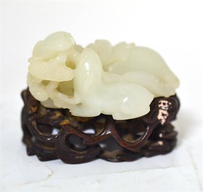 Lot 232 - A Chinese Pale Celadon Jade Type Group, as a recumbent goat and its young eating fungus, 5.5cm long
