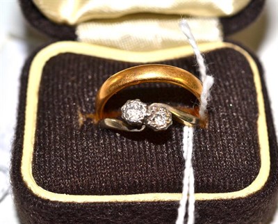 Lot 127 - An 18ct gold two stone diamond cross-over ring and a 22ct gold wedding band